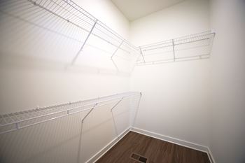 Walk-in closet with shelving at Wesley Place Apartments in Birmingham, AL